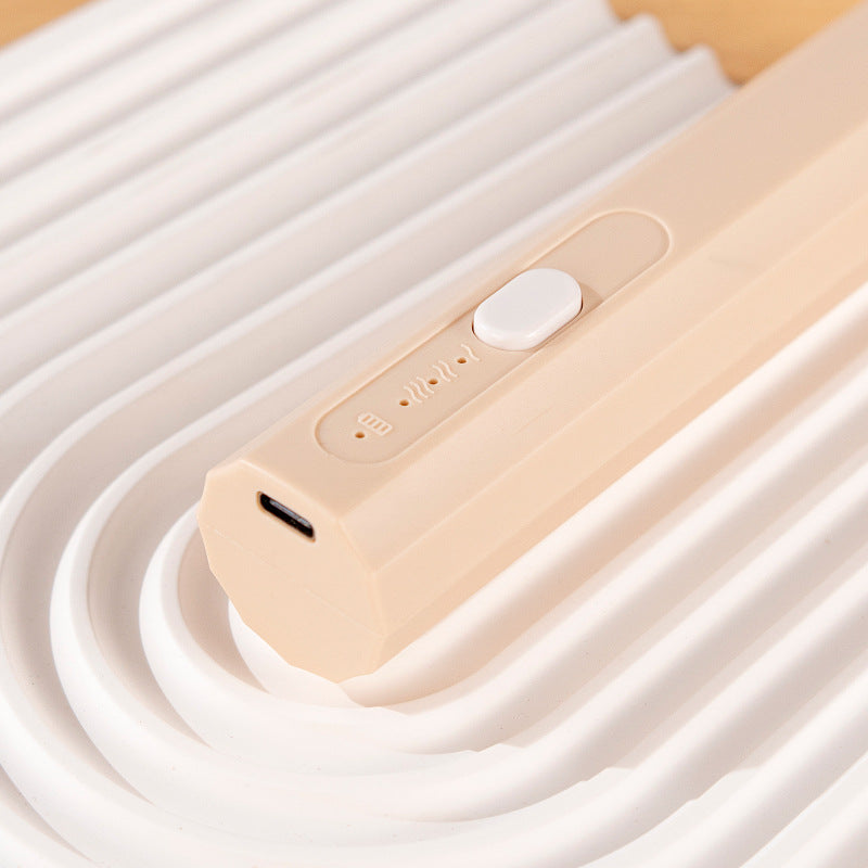 Frother wand in use — latte foam